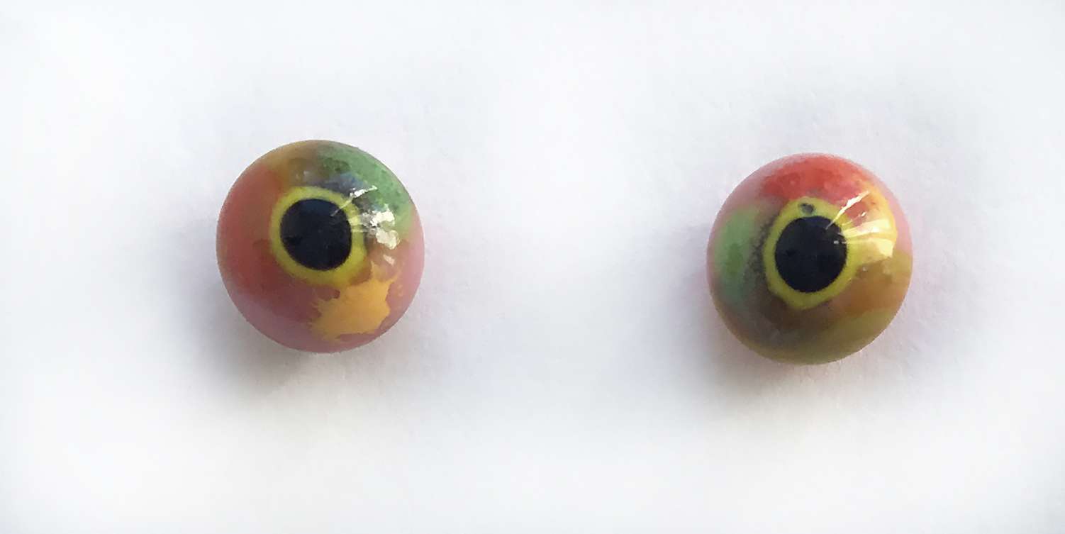 Yellow orange with pink and green. 6 mm. 2.5 euro.